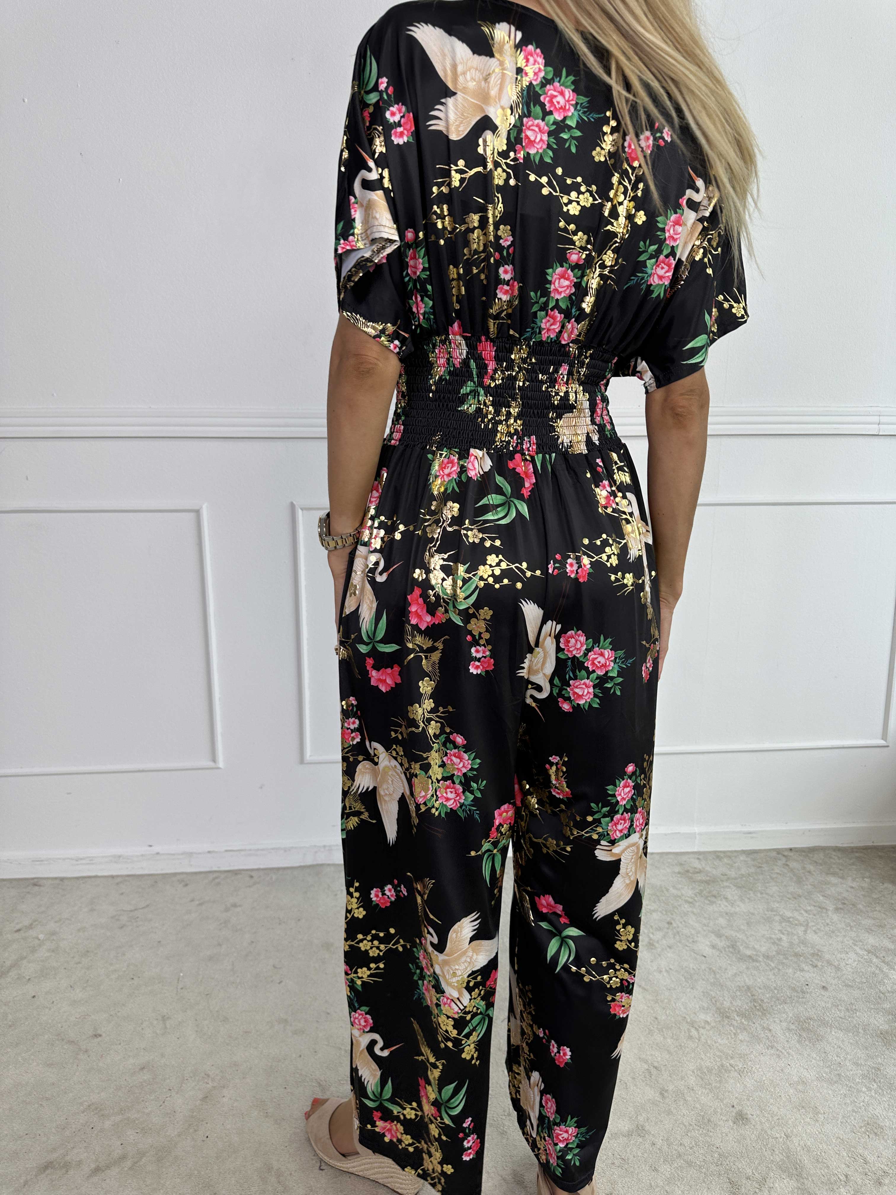Pams Fly Jumpsuit - Elastisk buksedragt med blomster- og fugleprint